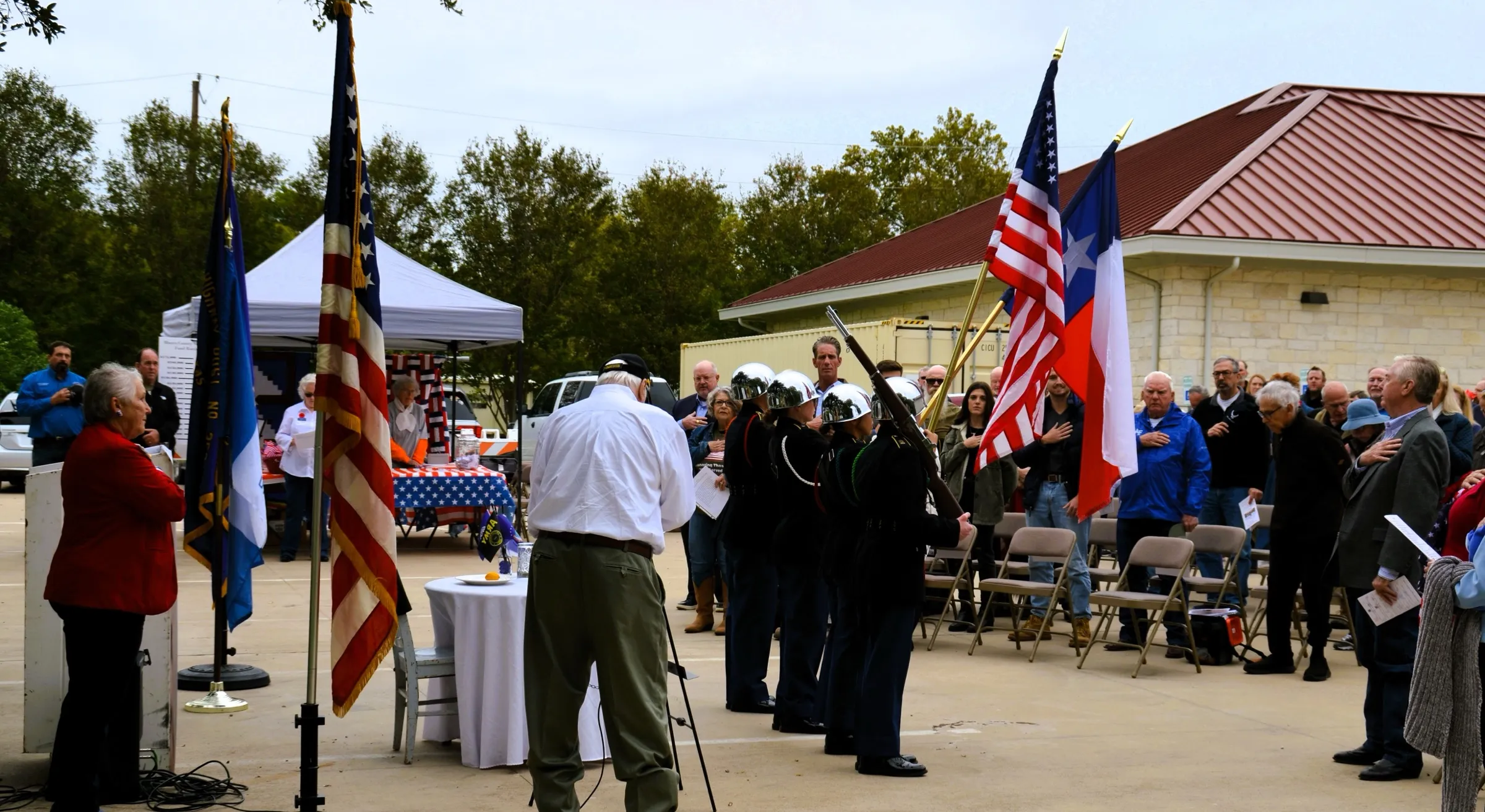 Community members with shovels at the groundbreaking ceremony