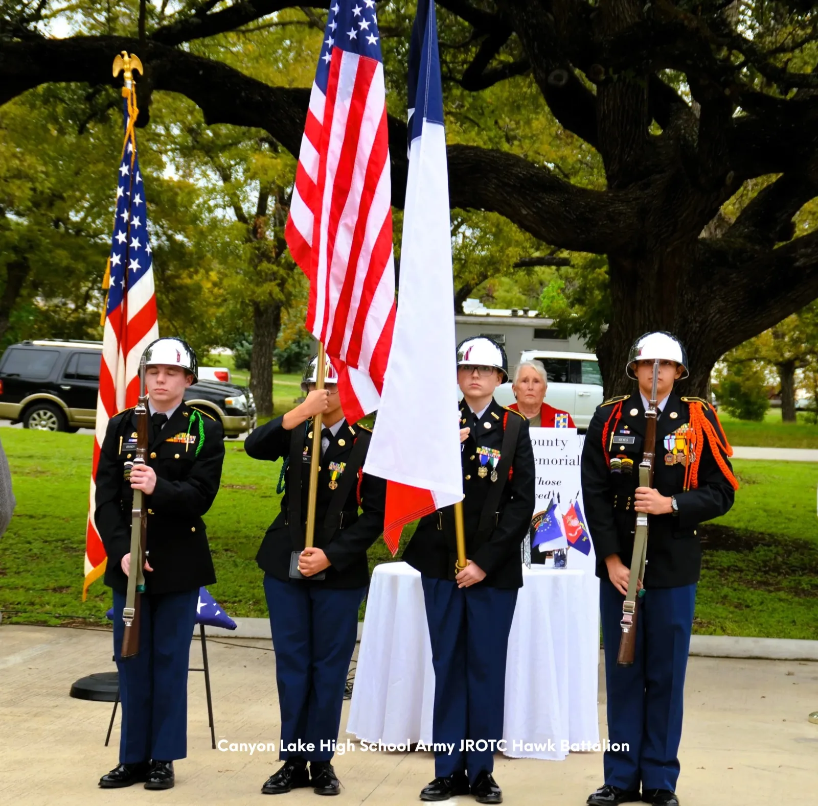 A high school JROTC color guard presenting the U.S. and Texas flags at the memorial